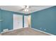A comfortable bedroom features blue walls and carpeted flooring at 399 Towler Drs, Loganville, GA 30052