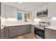 Modern kitchen with stainless steel appliances, stylish cabinetry, and ample countertop space at 399 Towler Drs, Loganville, GA 30052