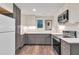 Modern kitchen with stainless steel appliances, two-tone cabinetry, and a window for natural light at 399 Towler Drs, Loganville, GA 30052