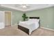 This comfortable main bedroom features a trey ceiling and neutral decor at 399 Towler Drs, Loganville, GA 30052
