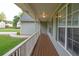 Spacious front porch with wood flooring and white railing offers a welcoming outdoor space at 399 Towler Drs, Loganville, GA 30052