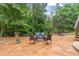 Relaxing backyard seating area with mature trees at 155 Edgewater Trl, Canton, GA 30115
