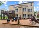 Large backyard with a spacious patio, comfortable seating, and access to a second-story deck at 155 Edgewater Trl, Canton, GA 30115