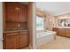 Beautiful bathroom with a soaking tub, wooden cabinets, and a large window at 155 Edgewater Trl, Canton, GA 30115