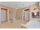 Relaxing bathroom with a separate shower and soaking tub, neutral tile, and a window to let in natural light at 155 Edgewater Trl, Canton, GA 30115