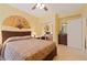 Cozy primary bedroom with ceiling fan, fan decor, and sliding closet doors at 155 Edgewater Trl, Canton, GA 30115