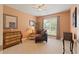Inviting bedroom with neutral tones, a ceiling fan and a large window for natural light at 155 Edgewater Trl, Canton, GA 30115