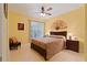 Comfortable bedroom featuring a ceiling fan, and a pair of nightstands at 155 Edgewater Trl, Canton, GA 30115