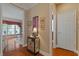 Hallway with hardwood flooring and decorative furniture piece at 155 Edgewater Trl, Canton, GA 30115