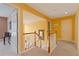 Upstairs hallway showcases neutral carpet, warm color palette, and bright natural light creating a welcoming atmosphere at 155 Edgewater Trl, Canton, GA 30115