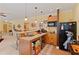 Cozy kitchen with light wood cabinets, tile floors, and stainless appliances at 155 Edgewater Trl, Canton, GA 30115