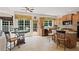 Bright kitchen features tile floors, granite counters, eat-in area, stainless appliances, and access to the outdoor deck at 155 Edgewater Trl, Canton, GA 30115