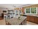 Open kitchen with granite countertops, a center island, and modern appliances at 155 Edgewater Trl, Canton, GA 30115