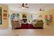 Comfortable living room with a fireplace, neutral-toned furniture, and large windows offering natural light and views at 155 Edgewater Trl, Canton, GA 30115