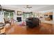 Open-concept living room features a fireplace, hardwood floors, and lots of natural light at 155 Edgewater Trl, Canton, GA 30115