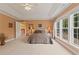 Open and airy main bedroom featuring a tray ceiling, ample natural light and neutral decor at 155 Edgewater Trl, Canton, GA 30115