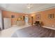 Bright main bedroom with neutral walls, tray ceilings, ceiling fan, and large window at 155 Edgewater Trl, Canton, GA 30115