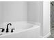 The bathroom features a soaking tub with modern fixtures and a glass-enclosed shower at 2139 Kirkham Way, Kennesaw, GA 30152