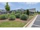 Beautifully landscaped community area with ornamental grasses, a black fence, and well-maintained grounds at 2139 Kirkham Way, Kennesaw, GA 30152