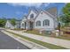 Charming home with a well-manicured lawn, elegant stonework, and a welcoming entrance at 2139 Kirkham Way, Kennesaw, GA 30152