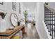 Elegant hallway with stylish decor, wood flooring, and a view into the open living area at 2139 Kirkham Way, Kennesaw, GA 30152