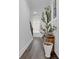 Hallway with hardwood floors and an elegant staircase leads to the rest of the home at 2139 Kirkham Way, Kennesaw, GA 30152