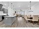 Modern kitchen with gray cabinetry, a large island, and stainless steel appliances at 2139 Kirkham Way, Kennesaw, GA 30152