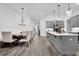 Open living space featuring a modern kitchen, dining area, and a comfortable living room setup at 2139 Kirkham Way, Kennesaw, GA 30152