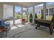Bright sunroom filled with natural light, ideal for relaxing and enjoying views of the backyard at 2139 Kirkham Way, Kennesaw, GA 30152