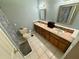 Bathroom featuring a dual sink vanity, tiled floors, and soothing paint at 23 Jennifer Ln, Rydal, GA 30171