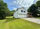 Charming two-story home featuring a front porch, two-car garage, and a spacious yard at 23 Jennifer Ln, Rydal, GA 30171
