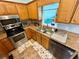 Close up of the functional kitchen sink and faucet with stainless steel appliances and granite countertop at 23 Jennifer Ln, Rydal, GA 30171