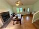 Cozy living room featuring a stone fireplace and a wooden dining table with seating for Gathering gatherings at 23 Jennifer Ln, Rydal, GA 30171