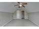 Attic featuring a door, neutral colored walls, carpet, and ceiling fan at 3865 Portico Run Dr, Buford, GA 30519