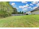 Expansive backyard featuring lush green grass and a privacy fence, ideal for outdoor activities and relaxation at 3865 Portico Run Dr, Buford, GA 30519