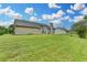 Lush green backyard with ample space, offering a serene outdoor retreat and potential for landscaping projects at 3865 Portico Run Dr, Buford, GA 30519