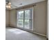 Bright bedroom with a large window and neutral carpeting, perfect for creating a serene atmosphere at 3865 Portico Run Dr, Buford, GA 30519