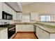 Well-appointed kitchen featuring granite countertops and stainless steel appliances at 3865 Portico Run Dr, Buford, GA 30519