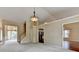 Bright living room with views to a staircase, kitchen, and other rooms at 3865 Portico Run Dr, Buford, GA 30519