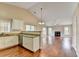 Open layout connecting the kitchen with stainless appliances to the living room at 3865 Portico Run Dr, Buford, GA 30519