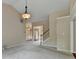 Living room with views to a staircase, front door, and another living room at 3865 Portico Run Dr, Buford, GA 30519