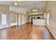 Open living space with hardwood floors that connects to the kitchen at 3865 Portico Run Dr, Buford, GA 30519