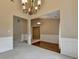 Spacious living area with hardwood flooring accents and a view into adjoining rooms at 3865 Portico Run Dr, Buford, GA 30519