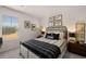 Well-lit bedroom with large window, carpeted floor, queen bed and side tables at 50 Leggett Dr # 184, Villa Rica, GA 30180