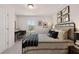 Comfortable bedroom features a queen bed, work desk, and natural lighting at 50 Leggett Dr # 184, Villa Rica, GA 30180