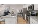 Modern kitchen with stainless steel appliances, granite countertops, and ample cabinet space at 50 Leggett Dr # 184, Villa Rica, GA 30180