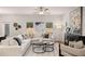 Bright living room featuring modern decor, ceiling fan, neutral tones, and lots of natural light at 50 Leggett Dr # 184, Villa Rica, GA 30180