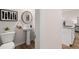 Stylish half bath with a pedestal sink and modern decor, conveniently located near the kitchen at 50 Leggett Dr # 184, Villa Rica, GA 30180