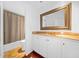 Bathroom with classic vanity, marble countertop, and shower with curtain at 52 Chaumont Nw Sq, Atlanta, GA 30327