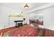 Bonus room with hardwood floors, piano and access to the Living Room at 52 Chaumont Nw Sq, Atlanta, GA 30327